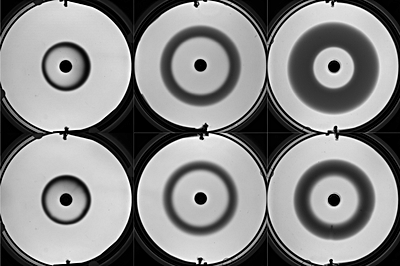 Foto: Ringförmige Reaktionsfronten mit Taylor-Aris-Dispersion im Labor (oben) und in einer Höhenforschungsrakete (unten). ©Copyright: K. Schwarzenberger